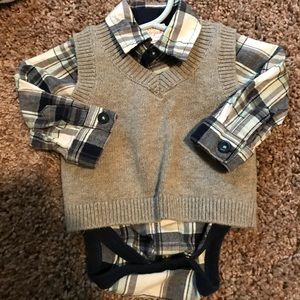 Sweater and plaid shirt set.